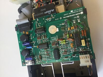 This printed circuit board is the analogic card of your Disk ][ that drives the motor and the read/write process on the floppy disks.